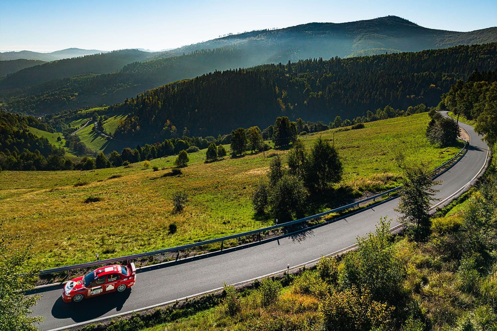 Rally car racing through forest